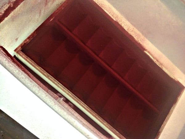 I did the flocking in a large tub to reclaim the loose material.